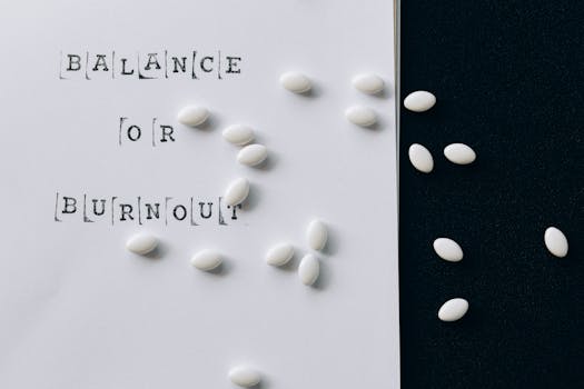 Conceptual image featuring 'Balance or Burnout' text with scattered white capsules.